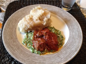 Eba (the white mass which is made from cassava), okro soup and tomato stew. Meal was served with beef.