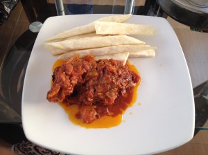 Fried yam with a fried fish, tomato and onion sauce. Had this at Ikoyo Club in Lagos. Their food is cheap! And it was good too.