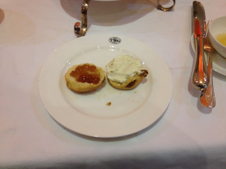 Left: Half a scone with TWG jelly. Right: Scone with clotted cream